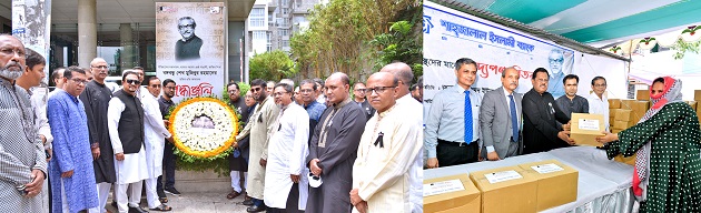 Placing wreaths on the portrait of Bangabandhu Sheikh Mujibur Rahman  Shahjalal Islami Bank Ltd. distributed relief materials among the destitute people